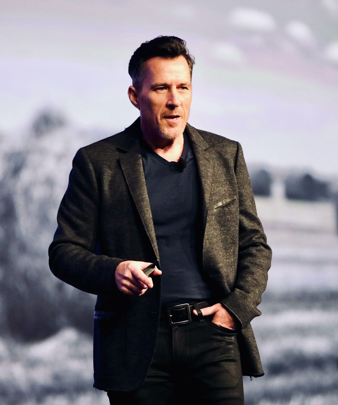 Danny O’Malley speaking on stage