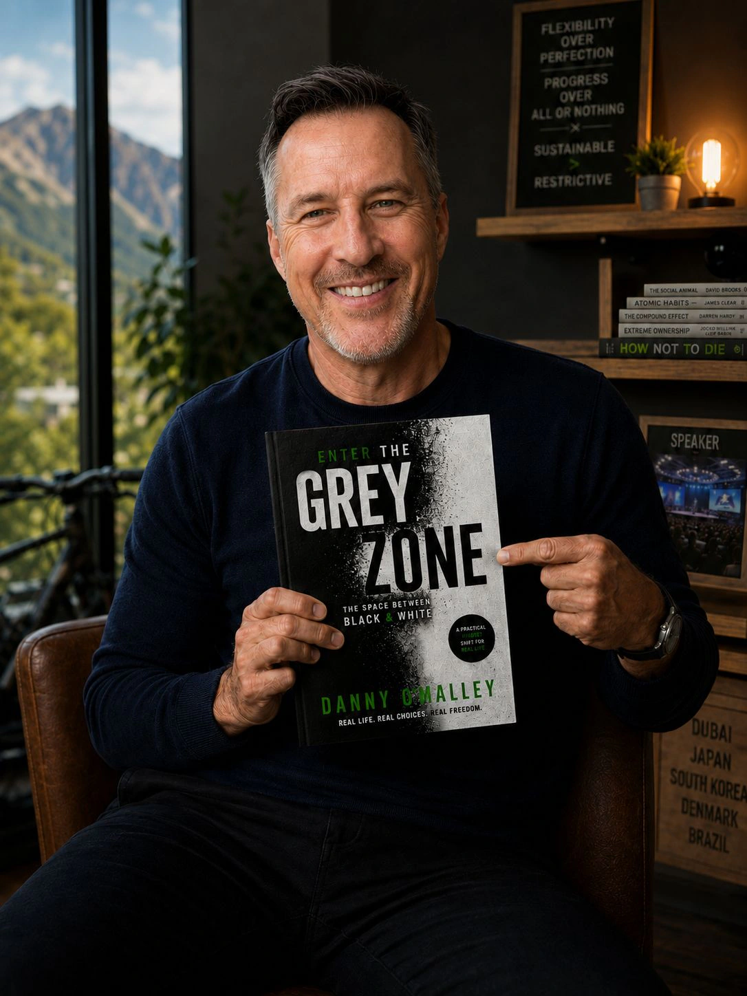 Danny O’Malley holding Enter the Grey Zone
